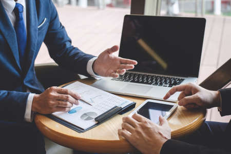 Business people team discuss and analyzing on meeting to planning investment project working and presentation strategy of business making conversation with partner, financial and accounting concept.の写真素材