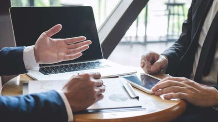 Professional Business partner team discussing on meeting to presentation planning investment project working analyzing and strategy of business making conversation with partner company.の写真素材