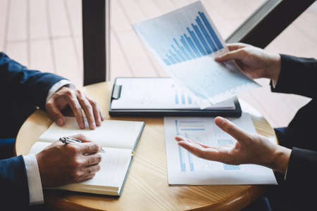 Business people team discuss and analyzing on meeting to planning investment project working and presentation strategy of business making conversation with partner, financial and accounting concept.の写真素材