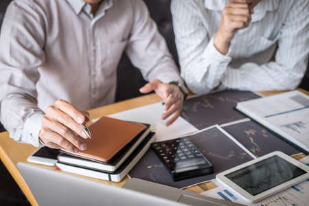 Business team on meeting to planning investment trading project and strategy of deal on a stock exchange with partner, financial and accounting concept, collaborative teamwork analyze data.の写真素材