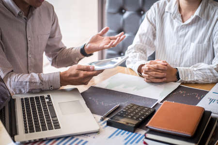 Business team on meeting to planning investment trading project and strategy of deal on a stock exchange with partner, financial and accounting concept, collaborative teamwork analyze data.の写真素材