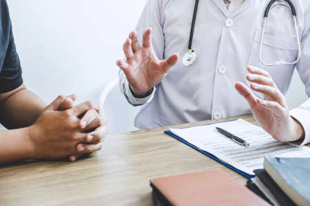 Doctor consulting with patient examining for patient, presenting results symptom about the problem and recommend treatment method, Healthcare and medical concept.の写真素材