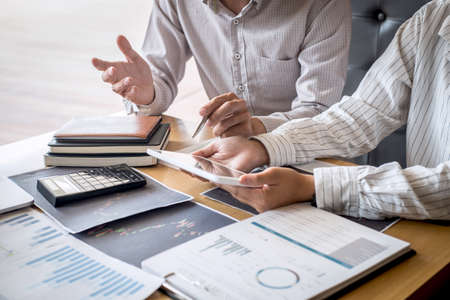 Business team on meeting to planning investment trading project and strategy of deal on a stock exchange with partner, financial and accounting concept, collaborative teamwork analyze data.の写真素材