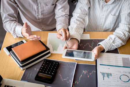 Business team on meeting to planning investment trading project and strategy of deal on a stock exchange with partner, financial and accounting concept, collaborative teamwork analyze data.の写真素材