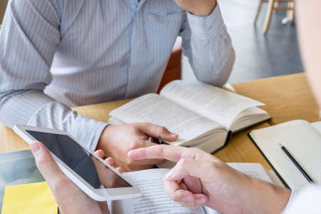 Tutor, learning, education, Group of teenager learning studying new lesson to knowledge in library...