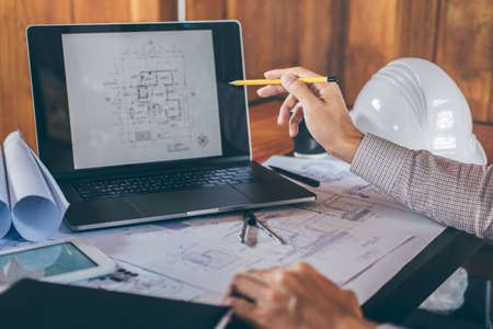 Construction engineering or architect hands working on blueprint inspection in workplace, while...