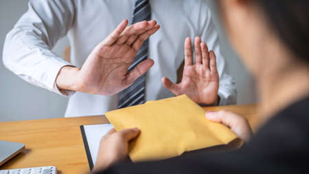 Anti bribery and corruption concept, Business man refusing and don't receive money banknote in...