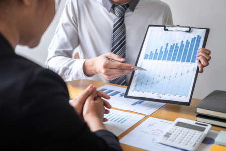 Professional Business partner discussing ideas planning and presentation project at meeting working and analysis at workspace, financial and investment concept, collaborative teamwork analyze data.の写真素材