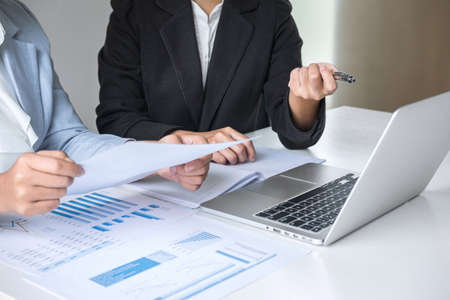 Businesswoman leader team conference on meeting presentation to planning investment project working and strategy of business making conversation with partner, financial and accounting concept.の写真素材