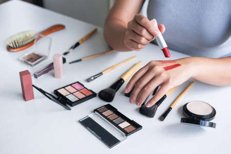 Elegant female Beauty blogger showing testing beauty cosmetic using product makeup tutorial cosmetics and sale product.の写真素材