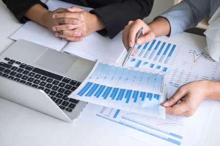 Businesswoman leader team conference on meeting presentation to planning investment project working and strategy of business making conversation with partner, financial and accounting concept.の写真素材