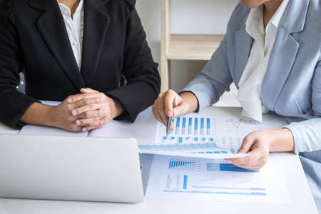 Businesswoman leader team conference on meeting presentation to planning investment project working and strategy of business making conversation with partner, financial and accounting concept.の写真素材