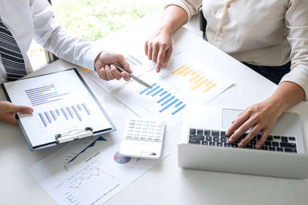 Group of Business leader team conference on meeting presentation to planning investment project working and strategy of business making conversation with partner, financial and accounting concept.の写真素材
