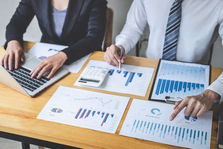 Professional Business partner discussing ideas planning and presentation project at meeting working and analysis at workspace, financial and investment concept, collaborative teamwork analyze data.の写真素材