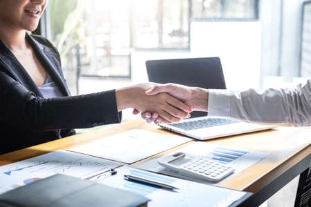 Finishing up a conversation after collaboration, handshake of two business people after contract agreement to become a partner, collaborative teamwork.の写真素材