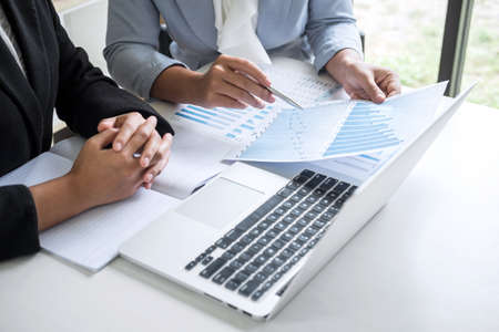 Businesswoman leader team conference on meeting presentation to planning investment project working and strategy of business making conversation with partner, financial and accounting concept.の写真素材