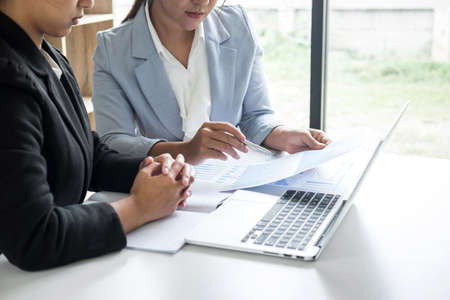 Businesswoman leader team conference on meeting presentation to planning investment project working and strategy of business making conversation with partner, financial and accounting concept.の写真素材