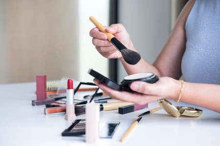 Elegant female Beauty blogger showing testing beauty cosmetic using product makeup tutorial cosmetics and sale product.の写真素材