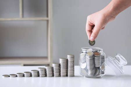 Images of growing stacking coins and Hand putting coin into glass bottle (money box) for planning...
