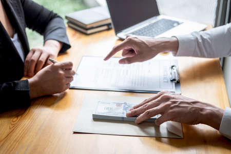 Dishonest cheating in business illegal money, Businessman giving bribe money in envelope to business...