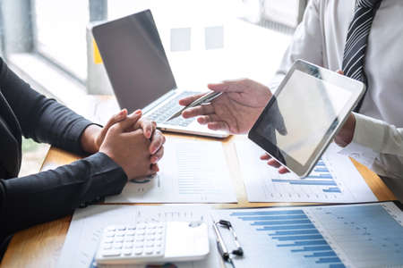 Professional Business partner discussing ideas planning and presentation project at meeting working and analysis at workspace, financial and investment concept, collaborative teamwork analyze data.の写真素材