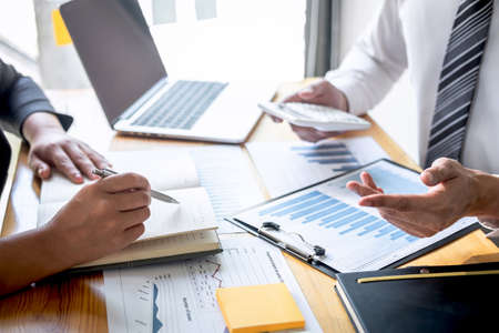 Professional Business partner discussing ideas planning and presentation project at meeting working and analysis at workspace, financial and investment concept, collaborative teamwork analyze data.の写真素材
