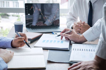 Business team discussion on meeting to planning investment trading project and strategy to investor of deal on a stock exchange with partner, financial and accounting concept, collaborative teamwork.の写真素材