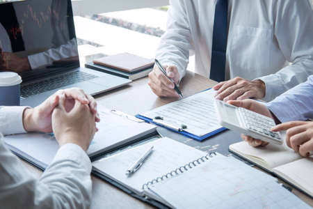 Business team discussion on meeting to planning investment trading project and strategy to investor of deal on a stock exchange with partner, financial and accounting concept, collaborative teamwork.の写真素材