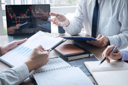 Business team discussion on meeting to planning investment trading project and strategy to investor of deal on a stock exchange with partner, financial and accounting concept, collaborative teamwork.の写真素材