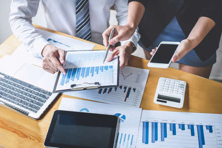 Professional Business partner discussing ideas planning and presentation project at meeting working and analysis at workspace, financial and investment concept, collaborative teamwork analyze data.の写真素材