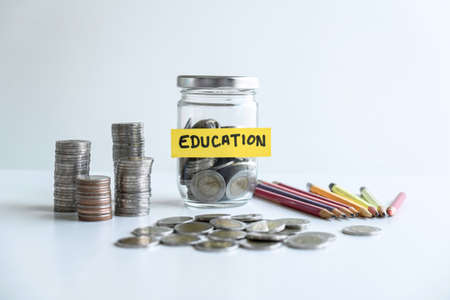 Images of coin in piggy bank for step up growing business to profit of each years and saving with piggy bank, Saving money for future plan education and retirement fund concept.の写真素材
