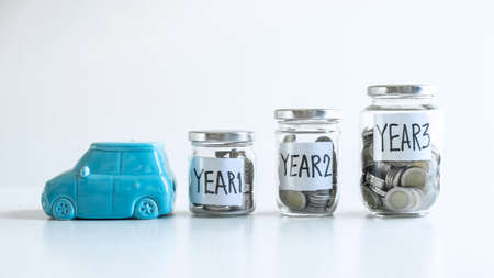 Images of coin in piggy bank for step up growing business to profit of each years and saving with piggy bank, Saving money for future plan education and retirement fund concept.の写真素材