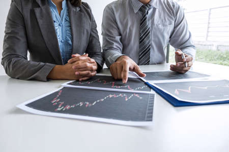 Business team on meeting to planning investment trading project and strategy of deal on a stock exchange with partner, financial and accounting concept, collaborative teamwork analyze data.の写真素材