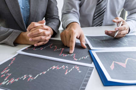 Business team discussion on meeting to planning investment trading project and strategy to investor of deal on a stock exchange with partner, financial and accounting concept, collaborative teamwork.の写真素材