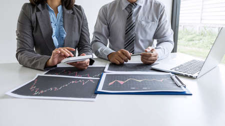 Business team discussion on meeting to planning investment trading project and strategy to investor of deal on a stock exchange with partner, financial and accounting concept, collaborative teamwork.の写真素材