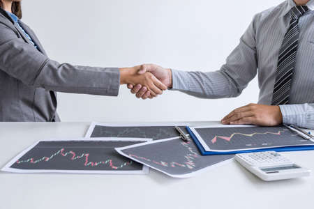 Finishing up a conversation after collaboration, handshake of two business woman leader after successful contract agreement to become a partner, collaborative negotiation partnership.の写真素材