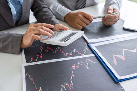 Business team on meeting to planning investment trading project and strategy of deal on a stock exchange with partner, financial and accounting concept, collaborative teamwork analyze data.の写真素材