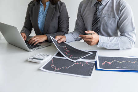 Business team discussion on meeting to planning investment trading project and strategy to investor of deal on a stock exchange with partner, financial and accounting concept, collaborative teamwork.の写真素材
