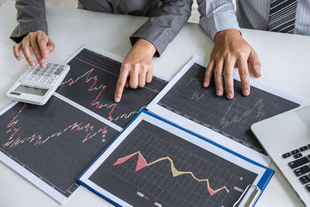 Business team discussion on meeting to planning investment trading project and strategy to investor of deal on a stock exchange with partner, financial and accounting concept, collaborative teamwork.の写真素材