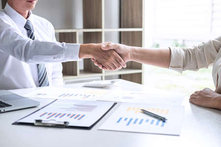 Finishing up a conversation after collaboration, handshake of two business people after success good...