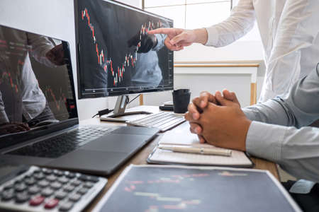 Business team discussion on meeting to planning investment trading project and strategy to investor of deal on a stock exchange with partner, financial and accounting concept, collaborative teamwork.の写真素材