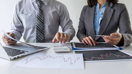 Business team on meeting to planning investment trading project and strategy of deal on a stock exchange with partner, financial and accounting concept, collaborative teamwork analyze data.の写真素材