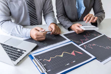 Business team on meeting to planning investment trading project and strategy of deal on a stock exchange with partner, financial and accounting concept, collaborative teamwork analyze data.の写真素材