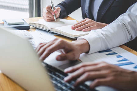 Professional Business partner discussing ideas planning and presentation project at meeting working and analysis at workspace, financial and investment concept, collaborative teamwork analyze data.の写真素材
