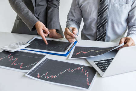 Business team discussion on meeting to planning investment trading project and strategy to investor of deal on a stock exchange with partner, financial and accounting concept, collaborative teamwork.の写真素材