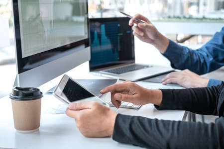 Business team discussion on meeting to planning investment trading project and strategy to investor of deal on a stock exchange with partner, financial and accounting concept, collaborative teamwork.の写真素材