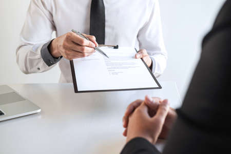 Employer arriving for a job interview, businesswoman listen to candidate answers explaining about her profile and colloquy dream job, manager sitting in job Interview talking in office.の写真素材