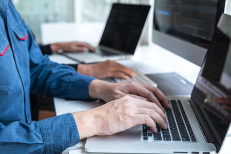 Team of Professional Developer programmer cooperation meeting and brainstorming and programming in website working a software and coding technology, writing codes and database.の写真素材