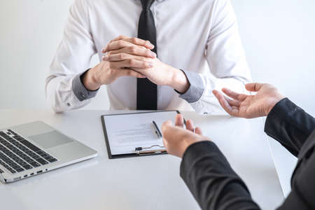 Employer arriving for a job interview, businesswoman listen to candidate answers explaining about her profile and colloquy dream job, manager sitting in job Interview talking in office.の写真素材