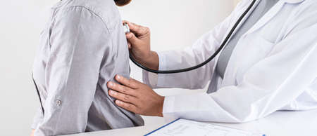 Doctor using a stethoscope checking patient with examining, presenting results symptom and recommend treatment method, Healthcare and medical concept.の写真素材